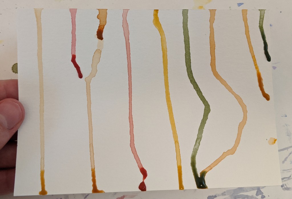 A similar drop painting using warmer colors and a highlight of dark green.