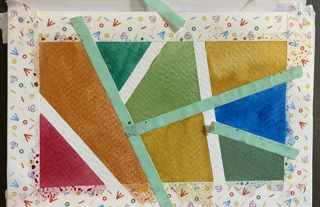 The three stages of unveiling how the watercolor stained glass turned out. First picture includes some washi tape, the middle only the border, and the last picture is the final result.